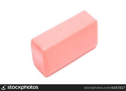a piece of pink soap on a white background