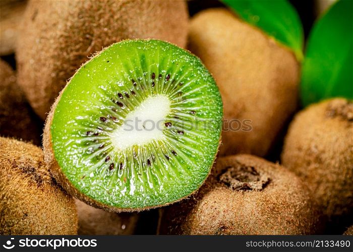 A piece of ripe kiwi. Macro background. Kiwi texture. High quality photo. A piece of ripe kiwi. Macro background.