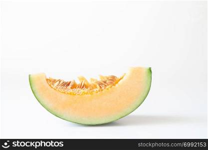 A piece of sliced orange melon or Japanese melon isolated on white background
