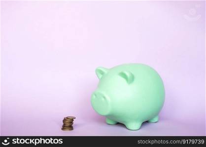 A piggy bank highlighted on a purple background with coins.. A piggy bank highlighted on a purple background with coins