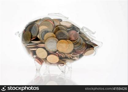 a piggy bank made of glass against a white background