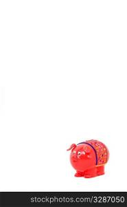 A piggy bank shot in the studio on a white background with copy space and a small drop shadow for depth