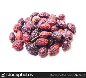 A pile berries of dried rosehips isolated on white. Dried dog-rose berries isolated