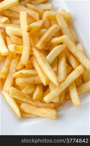 a pile of appetizing french fries on white plate. french fries
