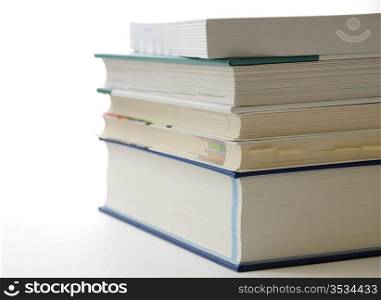 A pile of books with white copyspace