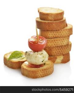 A Pile Of Bread Rusks With Mozzarella Cheese And Tomatoes
