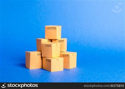 A pile of cardboard boxes. products, goods, commerce and retail. E-commerce, sale of goods through online trading platform. Freight shipping, deliver. sales of goods and services. Warehouse, stock