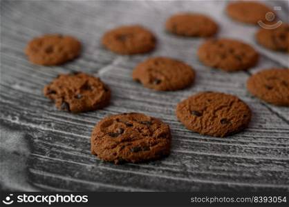 A pile of cookies on a wooden table