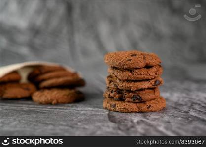 A pile of cookies on a wooden table