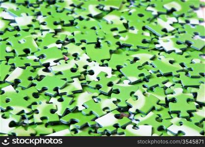 a pile of green puzzle, background