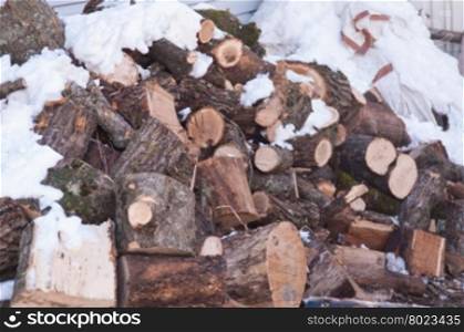A pile of logs for the wood prepared for the winter