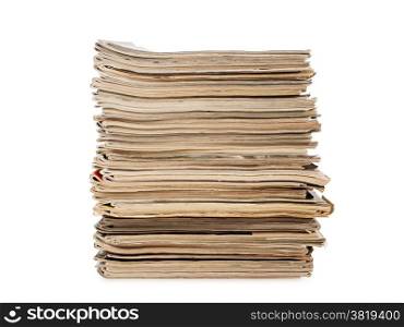 a pile of old yellow magazines isolated on white background, studio shot