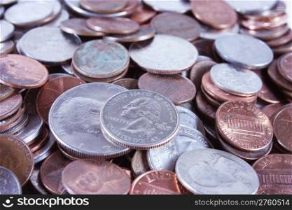 A pile of pennies, nickels, dimes and quarters