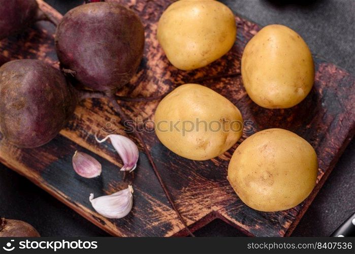 A pile of raw beets on the table. The benefits of vegetables. Harvest and natural products. A pile of raw beets on the table. The benefits of vegetables