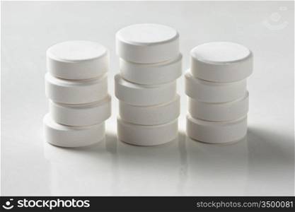 a pile of tablets on a white table