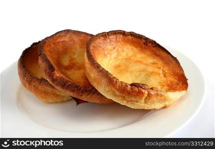 A pile of traditional English Yorkshire puddings, originally served with gravy as a starter but now usually with the main course.