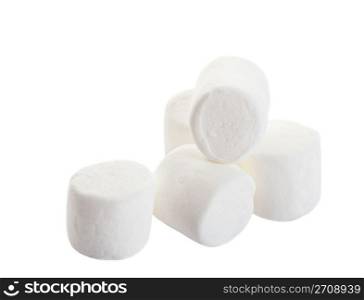 A pile of white puffy marshmallows. Shot on white background.