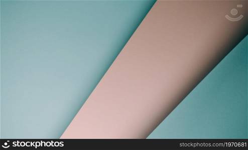 A pink and blue pastel flat lay background with sharp layers and shadows with copy space gender