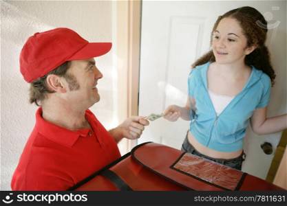 A pizza delivery man collecting payment from a customer. (focus on driver&rsquo;s face)