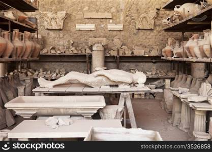 A plaster cast replica in an arcaheological working area of one of the Pompeii victims from the eruption of Mt. Vesuvius over 2000 years ago.