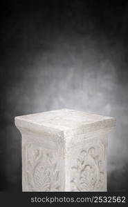 A Plaster column with nothing on its top.