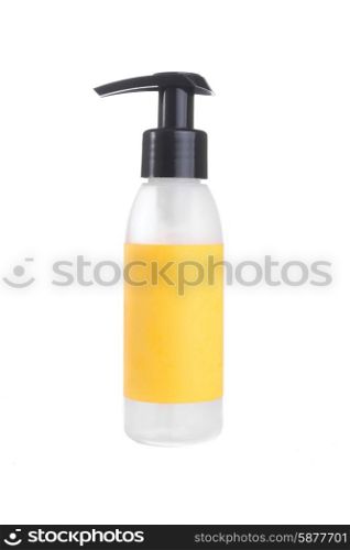 A plastic bottle with a yellow label and a black top with snoute stand on a white isolated background.