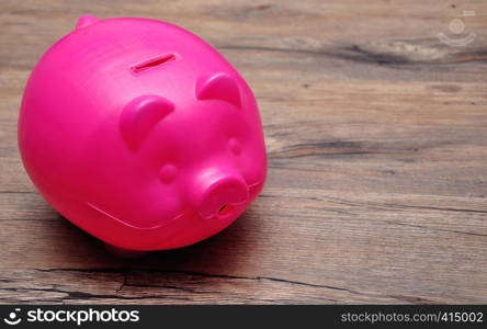 A plastic piggy bank on a table