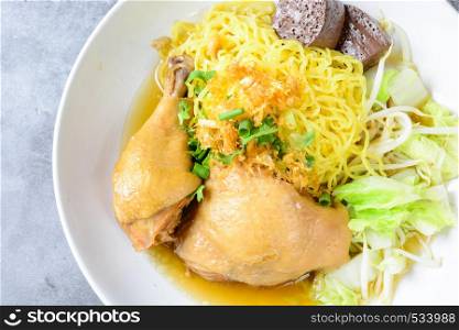 a plate of chicken and noodles soup with vegetables. Dish with fresh homemade chicken soup, noodles and vegetables