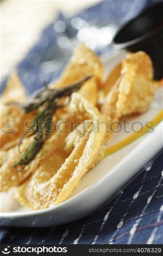A plate of chinese fried dumplings