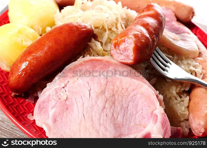 a plate of sauerkraut garnished Alsatian