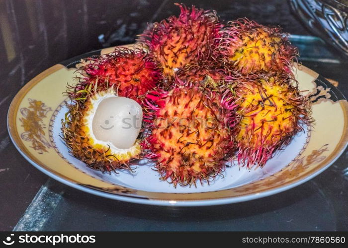 A plate of spiky rambutan fruits