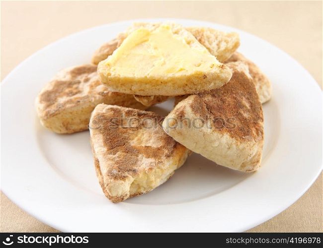 A plate of traditional, homemade British griddle scone or girdle scone. This kind of scone is popular in Scotland and Wales