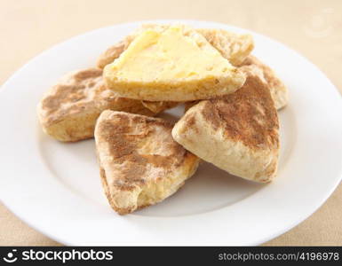 A plate of traditional, homemade British griddle scone or girdle scone. This kind of scone is popular in Scotland and Wales