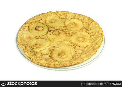 A plate with a pancake with apple slices on a white background.
