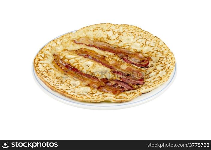 A plate with a pancake with bacon strips on a white background.