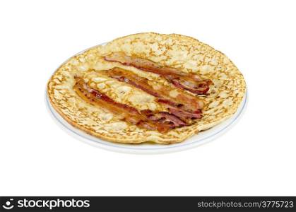 A plate with a pancake with bacon strips on a white background.
