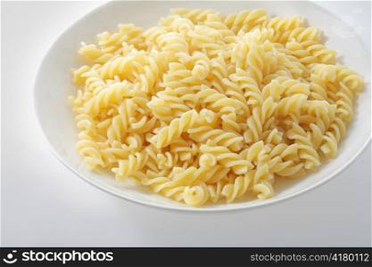 A plate with cooked pasta fusilli