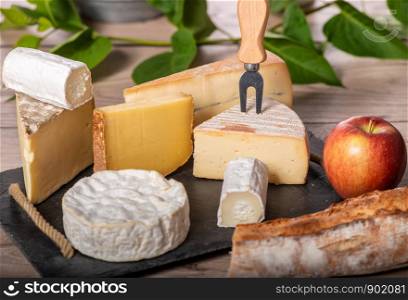 a platter of different french cheeses