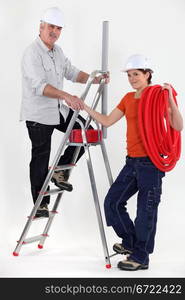 A plumber and his trainee.