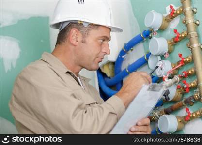 a plumber installing pressure meter