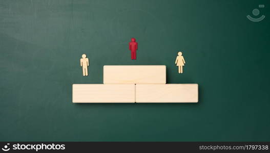 a podium made of wooden blocks and figurines of men. Career growth concept and goal achievement, reward for effort, strong leader