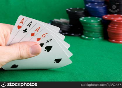 A poker hand with three of a kind Aces