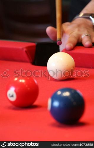 A pool player about to take a shot