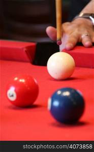 A pool player about to take a shot