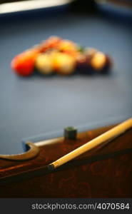 A pool table and cue