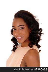 A portrait image of a African American women in a beige dress, smiling,isolated for white background.