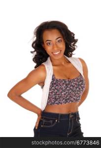 A portrait image of a african american women in a colorful top anblue jeans, isolated for white background.