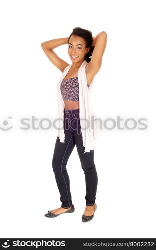 A portrait image of an African American women in a colorful top andblue jeans standing, isolated for white background.