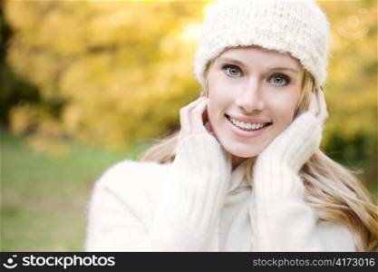 A portrait of a beautiful autumn woman outdoor