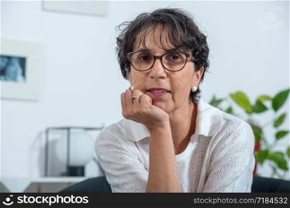 a portrait of a beautiful mature woman at home